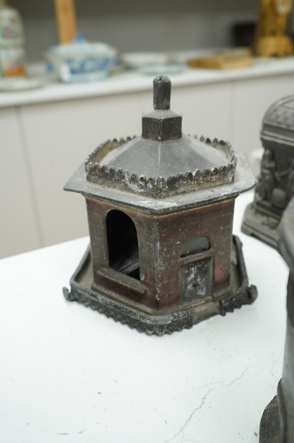 A collection of nine early 19th century lead tobacco boxes and a cover, tallest 20cm